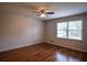 Bedroom featuring hardwood floors, a ceiling fan and a sunlit window at 2048 Kelvin Dr, Lawrenceville, GA 30043