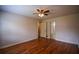 Bedroom boasting hardwood floors, neutral paint, and closet access at 2048 Kelvin Dr, Lawrenceville, GA 30043
