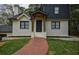 Close-up of the front of the home with brick facade and a brick walkway leading to the front porch at 2048 Kelvin Dr, Lawrenceville, GA 30043