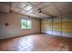 Spacious garage with painted walls, tile floors, overhead lighting, and window at 2048 Kelvin Dr, Lawrenceville, GA 30043