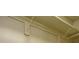 Wall showing shelving brackets and plumbing pipes at 2048 Kelvin Dr, Lawrenceville, GA 30043