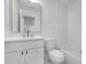 Bathroom featuring new vanity with a quartz countertop, brushed gold faucet, and shower/tub combo at 2095 Highway 20 Ne, Conyers, GA 30012