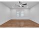 Bright bedroom features wood floors, recessed lighting, and a ceiling fan at 2095 Highway 20 Ne, Conyers, GA 30012
