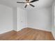 Bedroom featuring hardwood floors, a ceiling fan, and neutral paint at 2095 Highway 20 Ne, Conyers, GA 30012