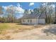 Back view of home highlighting the exterior and backyard space at 2095 Highway 20 Ne, Conyers, GA 30012
