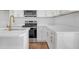 Well-appointed kitchen with a stainless steel oven, quartz countertops, and sleek white cabinetry at 2095 Highway 20 Ne, Conyers, GA 30012