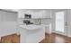Modern kitchen featuring white cabinets, quartz countertops, and stainless steel appliances at 2095 Highway 20 Ne, Conyers, GA 30012