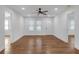Bright living room featuring gleaming hardwood floors, white trim, and recessed lighting at 2095 Highway 20 Ne, Conyers, GA 30012