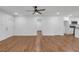 Bright living room featuring hardwood floors, recessed lighting, and an open layout leading to the kitchen at 2095 Highway 20 Ne, Conyers, GA 30012