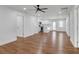 Open-concept living space with hardwood floors seamlessly flowing into the modern kitchen at 2095 Highway 20 Ne, Conyers, GA 30012