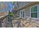 A ground level back deck with stairs leading to an upper deck and backyard views at 2806 Peachtree Walk, Duluth, GA 30096
