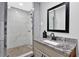 Modern bathroom with a new shower, granite counters and updated fixtures at 2806 Peachtree Walk, Duluth, GA 30096