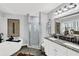 Bathroom with double vanities, soaking tub, and glass shower, showcasing modern design at 2806 Peachtree Walk, Duluth, GA 30096