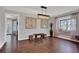 Dining room features modern light fixture and a bay window with a built-in bench at 2806 Peachtree Walk, Duluth, GA 30096