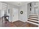 Inviting entryway with staircase, decorative wreath, and tiled door window at 2806 Peachtree Walk, Duluth, GA 30096