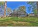 Spacious backyard with an in-ground pool and a large deck perfect for relaxing outdoors at 2806 Peachtree Walk, Duluth, GA 30096