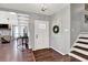 Foyer with stylish white door and decor with view of the living room at 2806 Peachtree Walk, Duluth, GA 30096