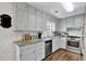 Kitchen boasts granite countertops, stainless steel appliances, and white subway tile backsplash at 2806 Peachtree Walk, Duluth, GA 30096