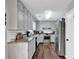 Modern kitchen with white cabinetry, stainless steel appliances, and granite countertops at 2806 Peachtree Walk, Duluth, GA 30096
