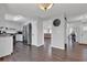 Open kitchen area with stainless steel appliances and view of the living room at 2806 Peachtree Walk, Duluth, GA 30096
