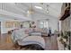 Open-concept living room with vaulted ceiling, fireplace, and a cozy seating area at 2806 Peachtree Walk, Duluth, GA 30096