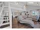 Spacious living room with high ceilings, a large sectional sofa, and hardwood floors at 2806 Peachtree Walk, Duluth, GA 30096