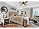 Bedroom with wood floors, ceiling fan, neutral bedding, bedside tables, and decorative accents at 2806 Peachtree Walk, Duluth, GA 30096