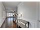 Bright entryway featuring hardwood floors, staircase, and decorative console table with stylish lamp at 4569 Grenadine Cir, Acworth, GA 30101