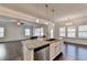 Modern kitchen with a granite island, stainless steel dishwasher, and open layout into the living area at 4569 Grenadine Cir, Acworth, GA 30101