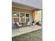 Charming patio featuring wicker seating, an outdoor rug and a privacy curtain at 4569 Grenadine Cir, Acworth, GA 30101