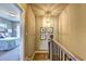Hallway featuring a staircase with an elegant chandelier and decor at 2822 Evanshire Ave # 111, Duluth, GA 30096