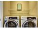 Well-equipped laundry room with modern appliances and organized shelving at 2822 Evanshire Ave # 111, Duluth, GA 30096