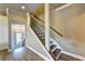 Staircase with wooden treads, white risers, and a dark railing at 2822 Evanshire Ave # 111, Duluth, GA 30096