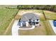 Aerial view of a stunning two-story home with manicured lawns, a circular driveway, and mature landscaping at 2900 Waterford Dr, Conyers, GA 30094