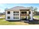 Expansive backyard featuring a covered patio and balcony, perfect for outdoor entertaining and relaxation at 2900 Waterford Dr, Conyers, GA 30094