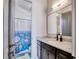 Granite vanity with a view into a full bathroom with a shower and tub at 2900 Waterford Dr, Conyers, GA 30094