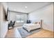 Bright bedroom featuring a large window, modern desk setup, and plush rug at 2900 Waterford Dr, Conyers, GA 30094