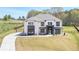Stunning two-story home with a manicured lawn, modern architectural details and a long driveway at 2900 Waterford Dr, Conyers, GA 30094