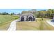 Elegant two-story home with a lush green lawn, complemented by a modern design and inviting entrance at 2900 Waterford Dr, Conyers, GA 30094