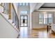 Elegant foyer featuring hardwood floors, staircase, and a view of the front entrance at 2900 Waterford Dr, Conyers, GA 30094