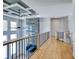 Bright hallway with decorative ceiling and balcony overlooking the living room at 2900 Waterford Dr, Conyers, GA 30094