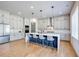 Open kitchen layout with waterfall island and stainless steel appliances at 2900 Waterford Dr, Conyers, GA 30094