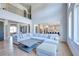 Expansive living room with hardwood floors, large sectional sofa and open kitchen view at 2900 Waterford Dr, Conyers, GA 30094