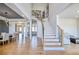 Open-concept living space with hardwood floors, a staircase and ample natural light at 2900 Waterford Dr, Conyers, GA 30094