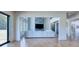 Open-concept living room with large windows and a stylish fireplace accent wall at 2900 Waterford Dr, Conyers, GA 30094