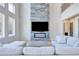 Bright living room features a fireplace with stone accent wall and large windows at 2900 Waterford Dr, Conyers, GA 30094
