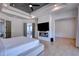 Spacious primary bedroom suite features hardwood flooring, a ceiling fan, and access to the ensuite at 2900 Waterford Dr, Conyers, GA 30094