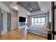 Spacious primary bedroom suite features hardwood flooring, a ceiling fan, and access to the balcony at 2900 Waterford Dr, Conyers, GA 30094