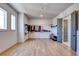 Large walk-in closet featuring wood floors, natural light from windows and custom gray doors to the bathroom at 2900 Waterford Dr, Conyers, GA 30094