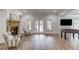 Spacious basement featuring a stone fireplace, lots of natural light, and a foosball table for entertainment at 5394 Brendlynn Dr, Suwanee, GA 30024